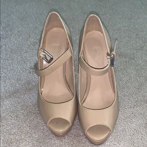 These are super cute tan high heels!